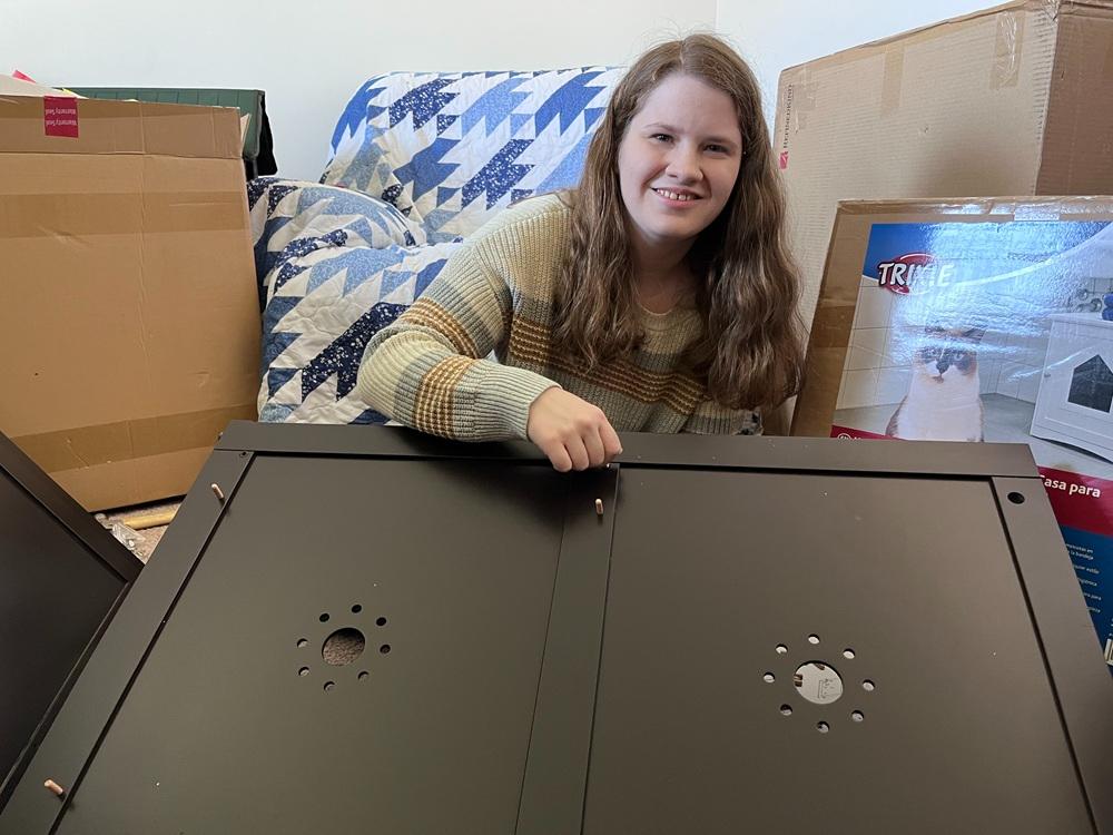 The tester is assembling the litter box enclosures for testing and review.