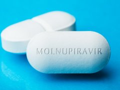 Close up of a white tablet with Molnupiravir written on it